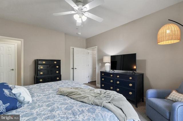 carpeted bedroom featuring ceiling fan