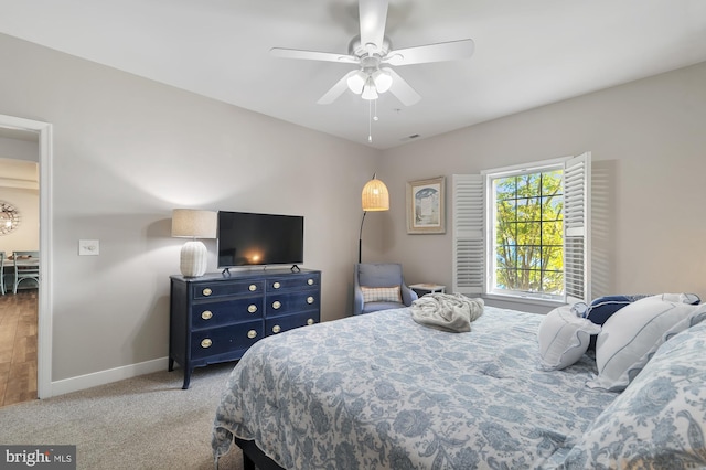 carpeted bedroom with ceiling fan