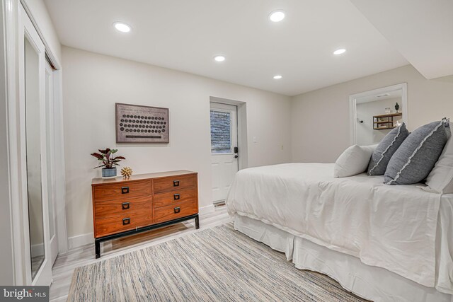 bedroom with light hardwood / wood-style floors