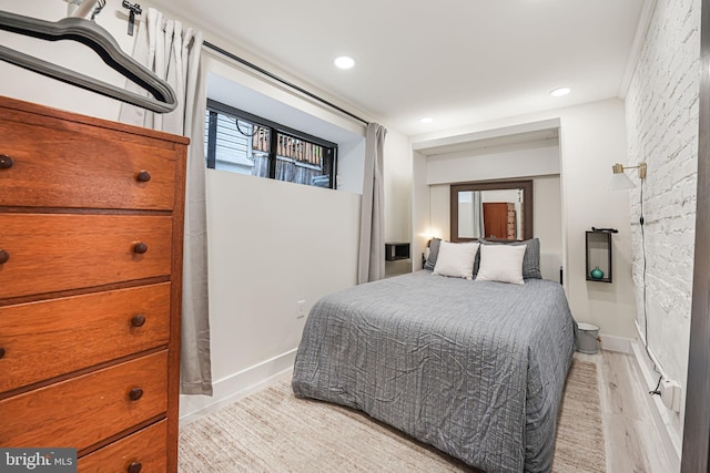 bedroom with light hardwood / wood-style flooring