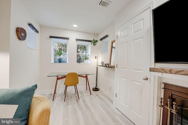 living area with light hardwood / wood-style floors