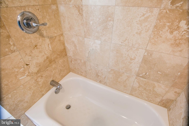 bathroom featuring a tub