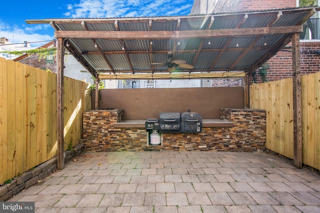 view of patio / terrace with grilling area and ceiling fan