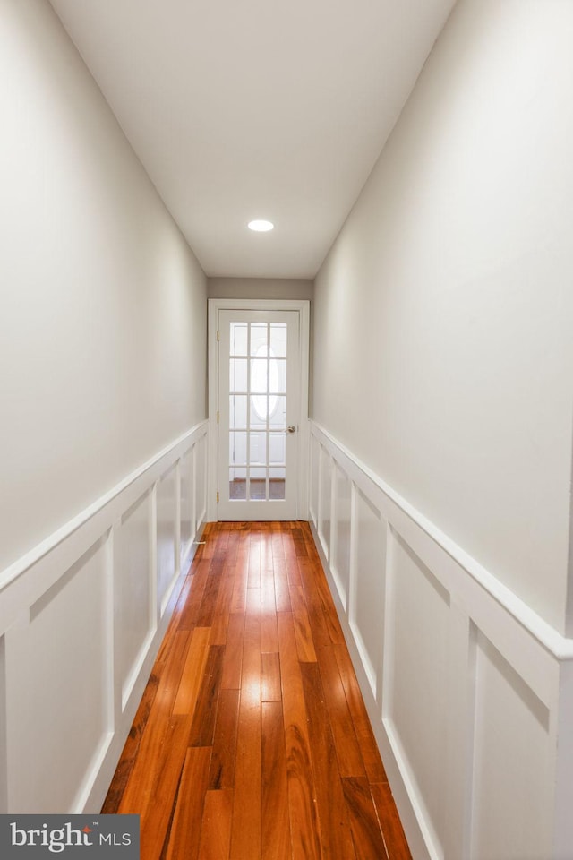 hallway featuring hardwood / wood-style flooring