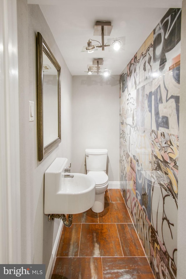 bathroom with sink and toilet