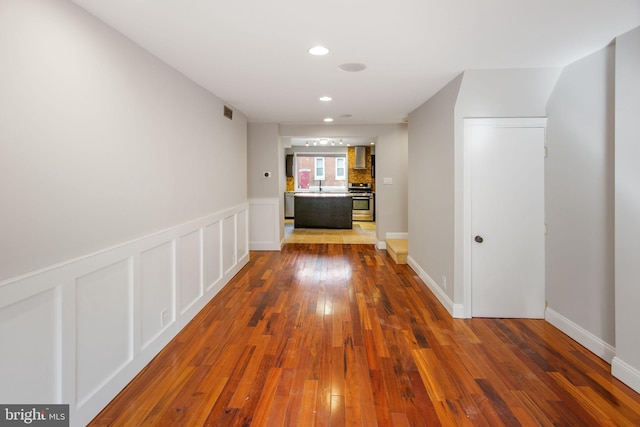 corridor with dark wood-type flooring