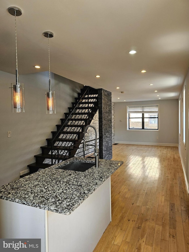 stairway featuring hardwood / wood-style flooring