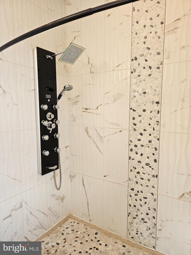 interior space with tiled shower