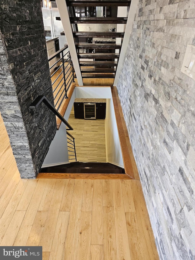 stairs with hardwood / wood-style floors