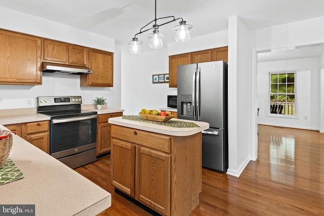 kitchen with stainless steel appliances, hanging light fixtures, dark hardwood / wood-style flooring, and a center island