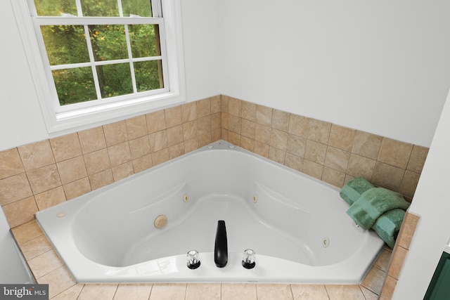 bathroom featuring tiled bath