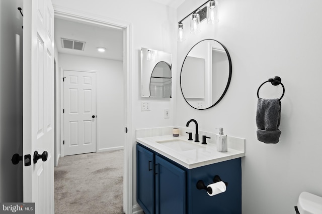 bathroom with vanity and toilet