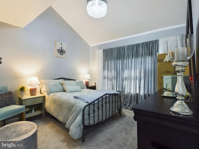 carpeted bedroom featuring lofted ceiling