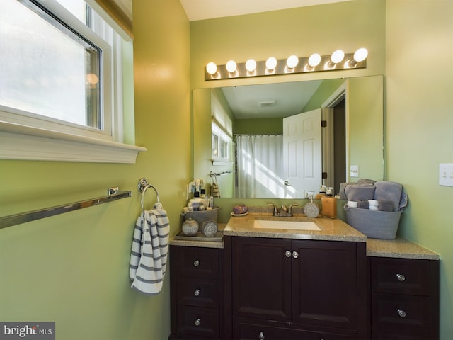 bathroom featuring vanity and a wealth of natural light