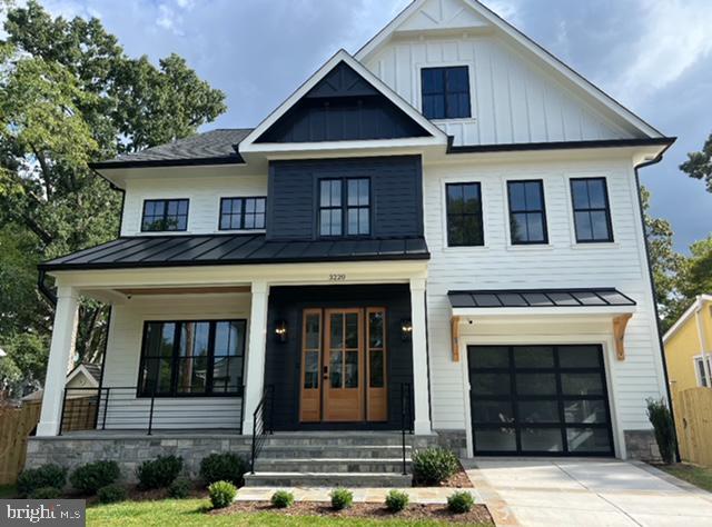 modern farmhouse style home with a garage and a porch