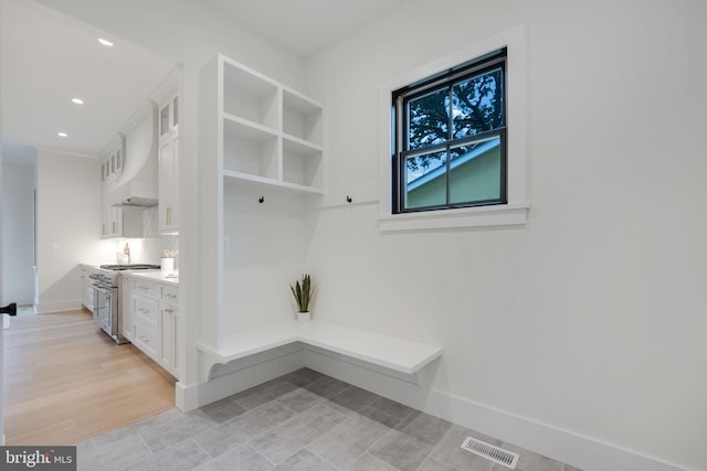 mudroom with light hardwood / wood-style floors