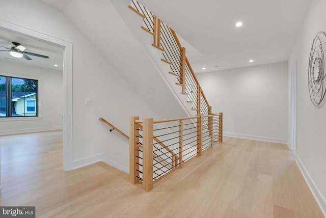 stairs with hardwood / wood-style flooring