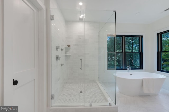 bathroom with independent shower and bath