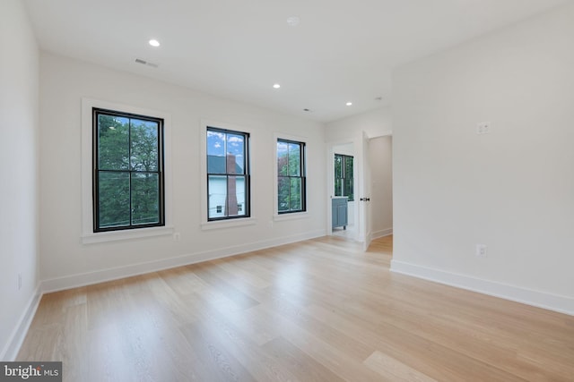 spare room featuring light wood-type flooring