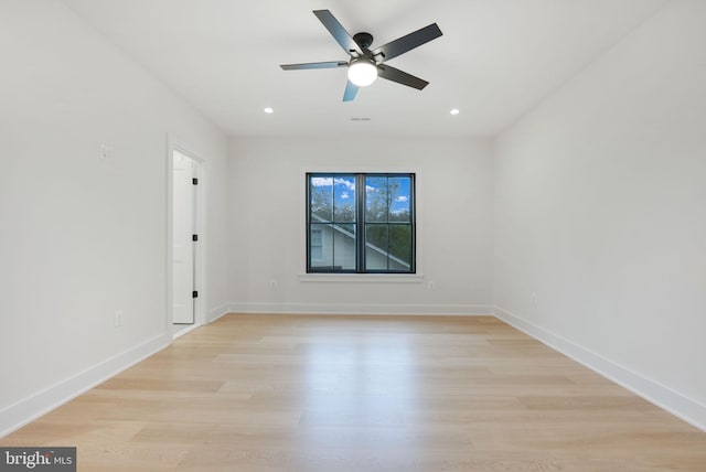 spare room with ceiling fan and light hardwood / wood-style flooring