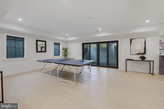 recreation room with light hardwood / wood-style floors