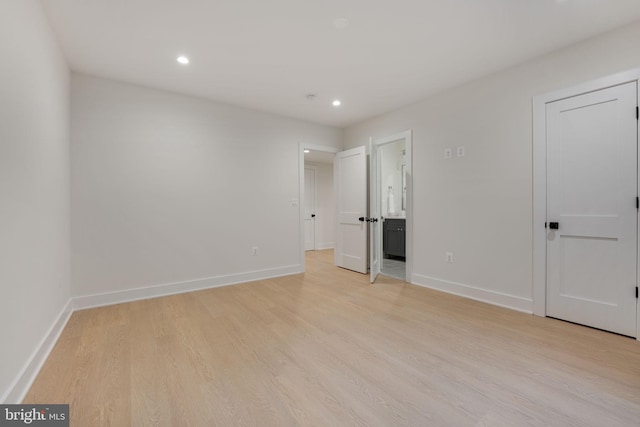 empty room with light hardwood / wood-style floors