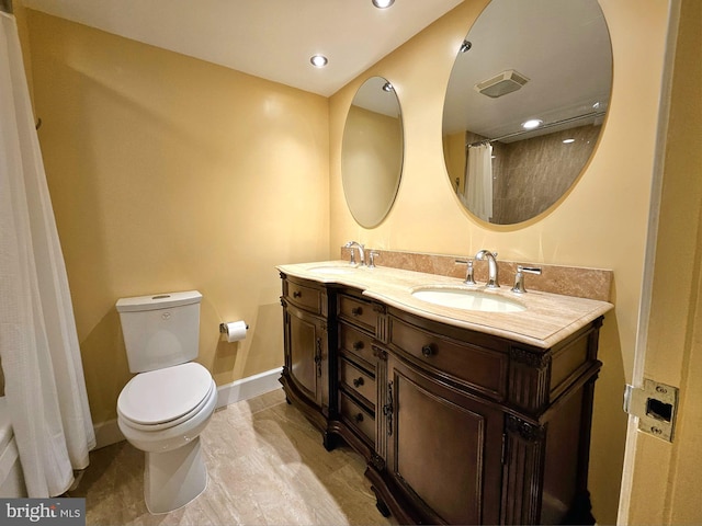 1080 Wisconsin Ave NW Unit 103/104, Washington, DC 20007 - bathroom with a sink, baseboards, toilet, and double vanity