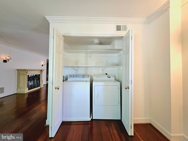 1080 Wisconsin Ave NW Unit 103/104, Washington, DC 20007 - laundry room with laundry area, visible vents, dark wood-style floors, and washer and clothes dryer