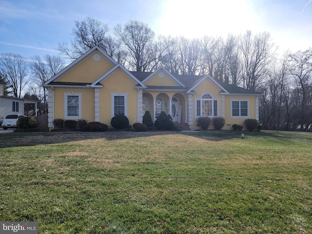 ranch-style house with a front lawn