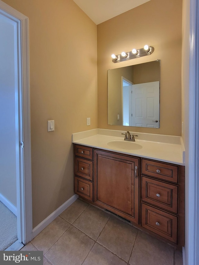 bathroom with tile patterned flooring and vanity