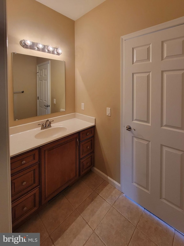 bathroom with tile patterned floors and vanity