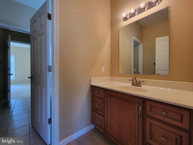 bathroom featuring tile patterned flooring and vanity