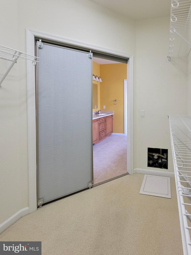 unfurnished living room with carpet flooring and sink