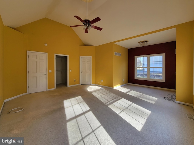 interior space with ceiling fan and vaulted ceiling