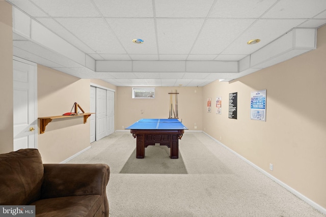 game room featuring a drop ceiling and light colored carpet