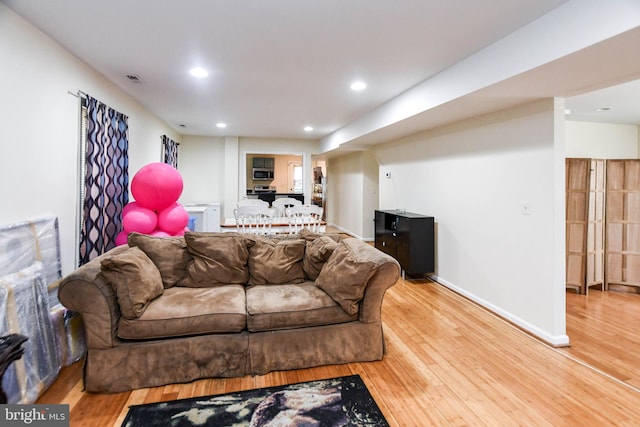 living room with hardwood / wood-style flooring