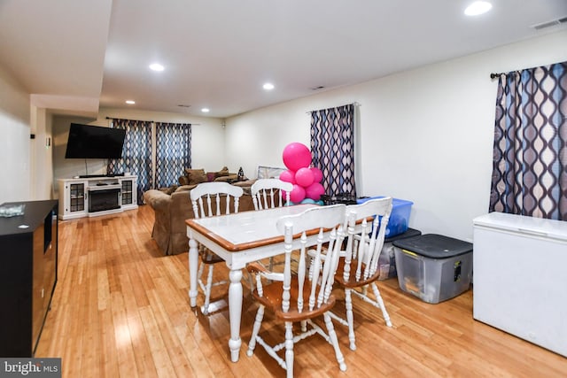 dining space featuring wood-type flooring