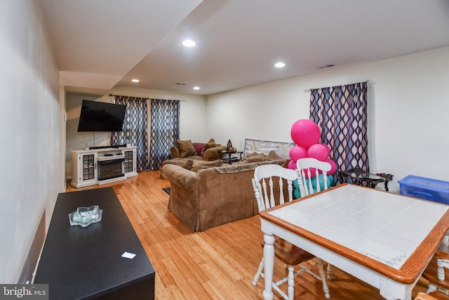 living room with light hardwood / wood-style floors