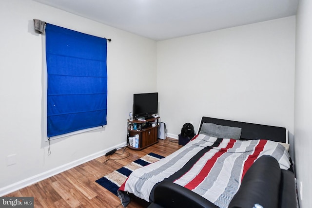 bedroom featuring hardwood / wood-style floors