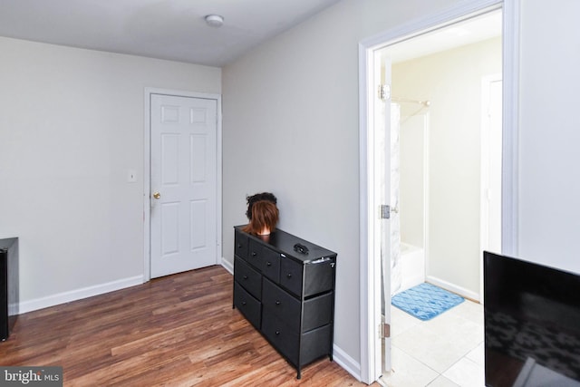 corridor with dark hardwood / wood-style flooring