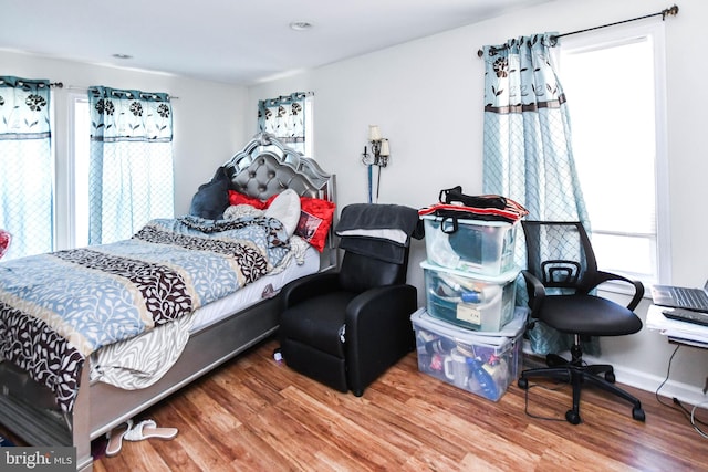 bedroom with hardwood / wood-style floors