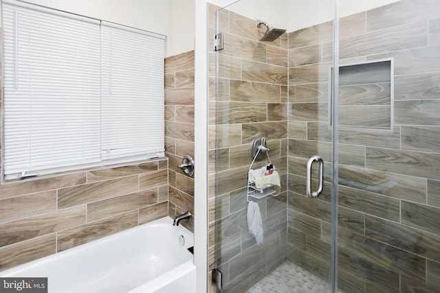 bathroom with shower with separate bathtub