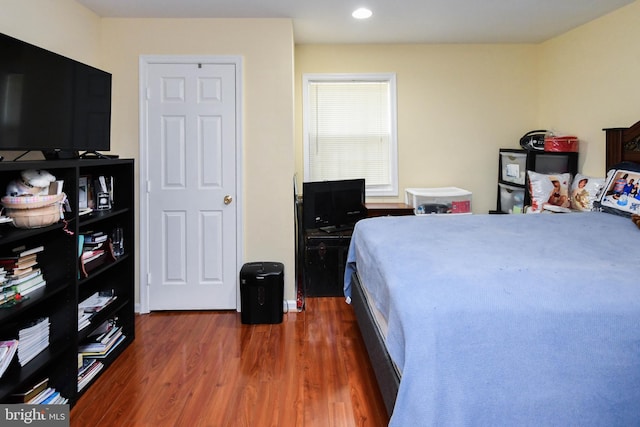 bedroom featuring dark hardwood / wood-style flooring