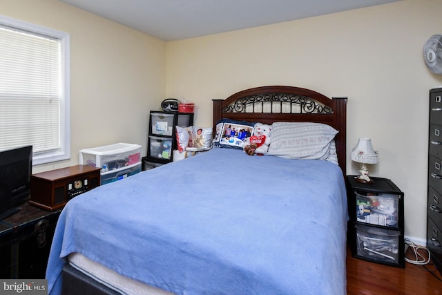 bedroom featuring dark wood-type flooring