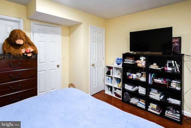 bedroom featuring dark hardwood / wood-style flooring