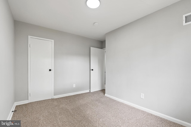 unfurnished bedroom with carpet flooring