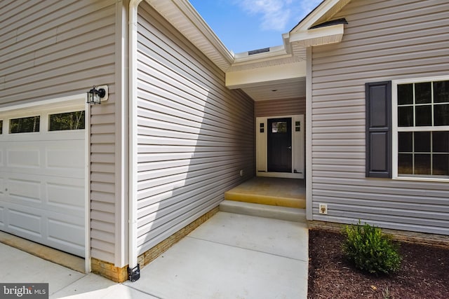 property entrance featuring a garage