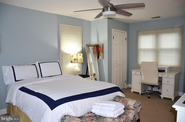 bedroom with carpet, ceiling fan, and a closet