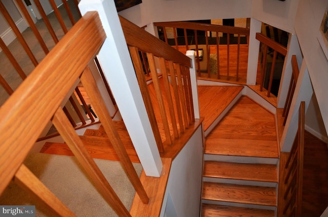 stairway featuring hardwood / wood-style floors