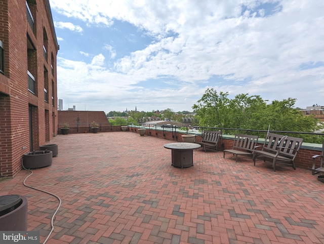 view of patio featuring an outdoor fire pit